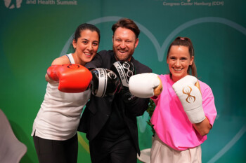 three people with boxing gloves